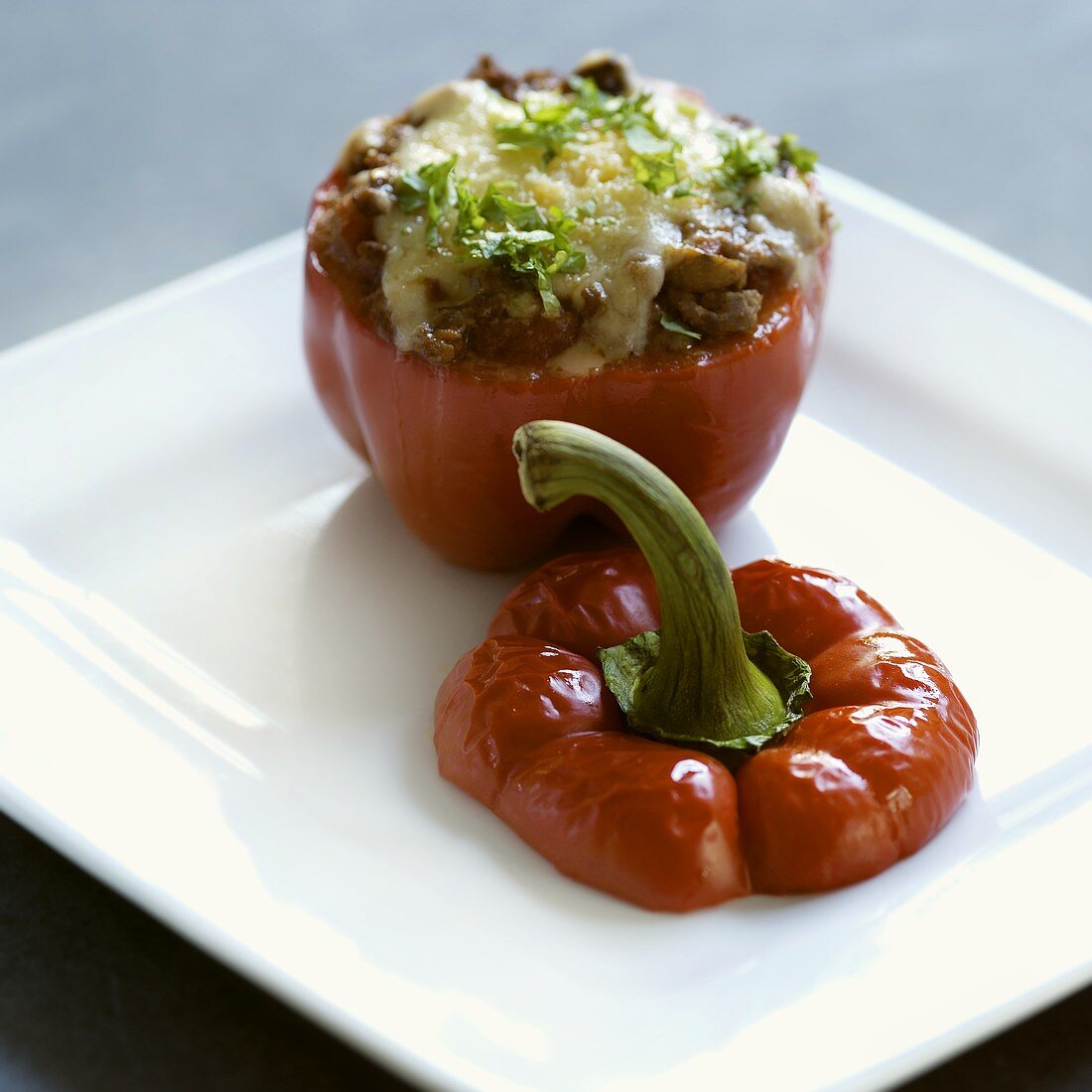 Stuffed baked pepper with cheese topping