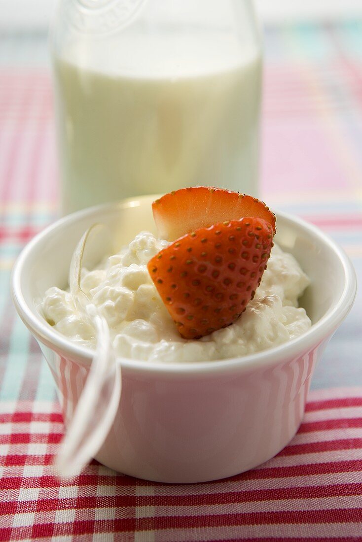 Cottage cheese and strawberry in a small bowl