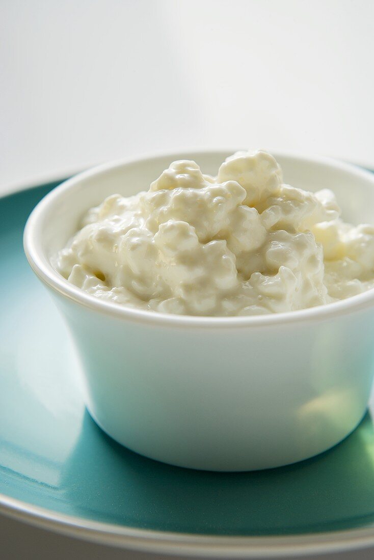 Cottage cheese in a small bowl on plate