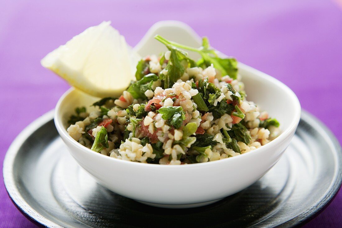 Pearl barley and parsley salad in a bowl