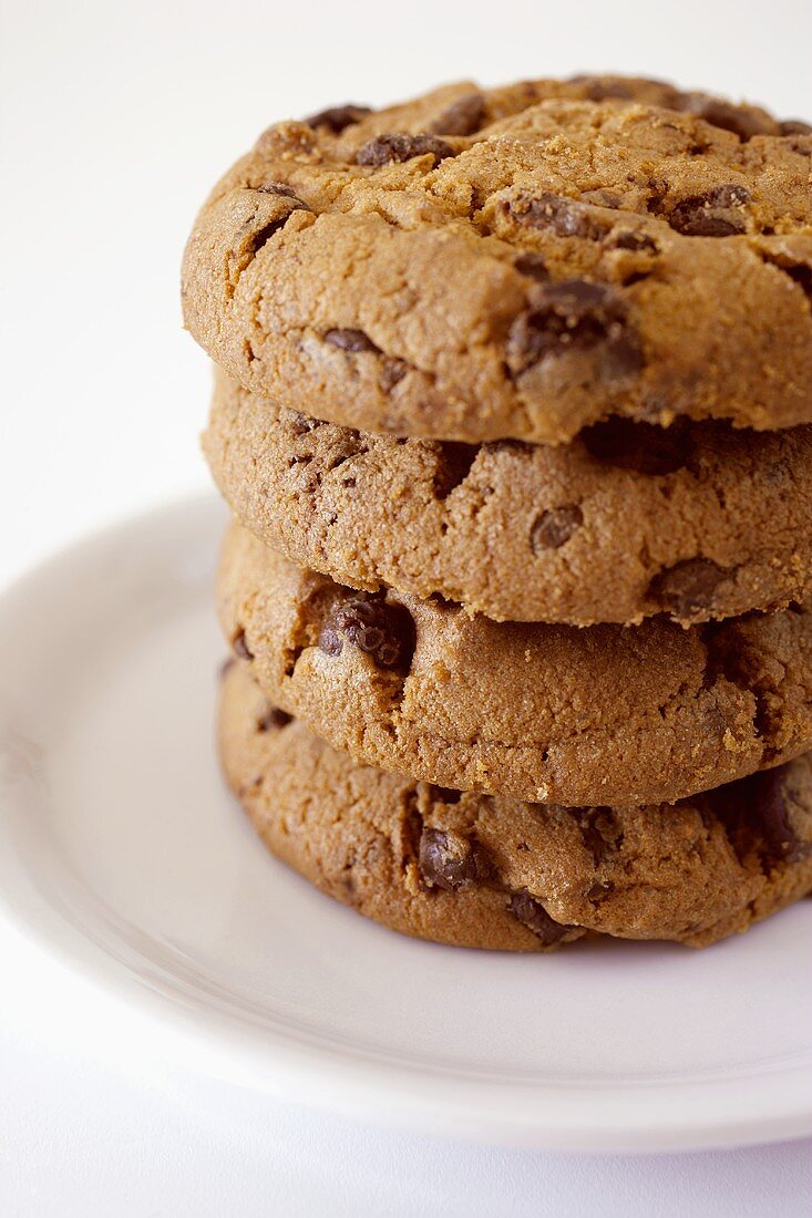 Four chocolate cookies in a pile