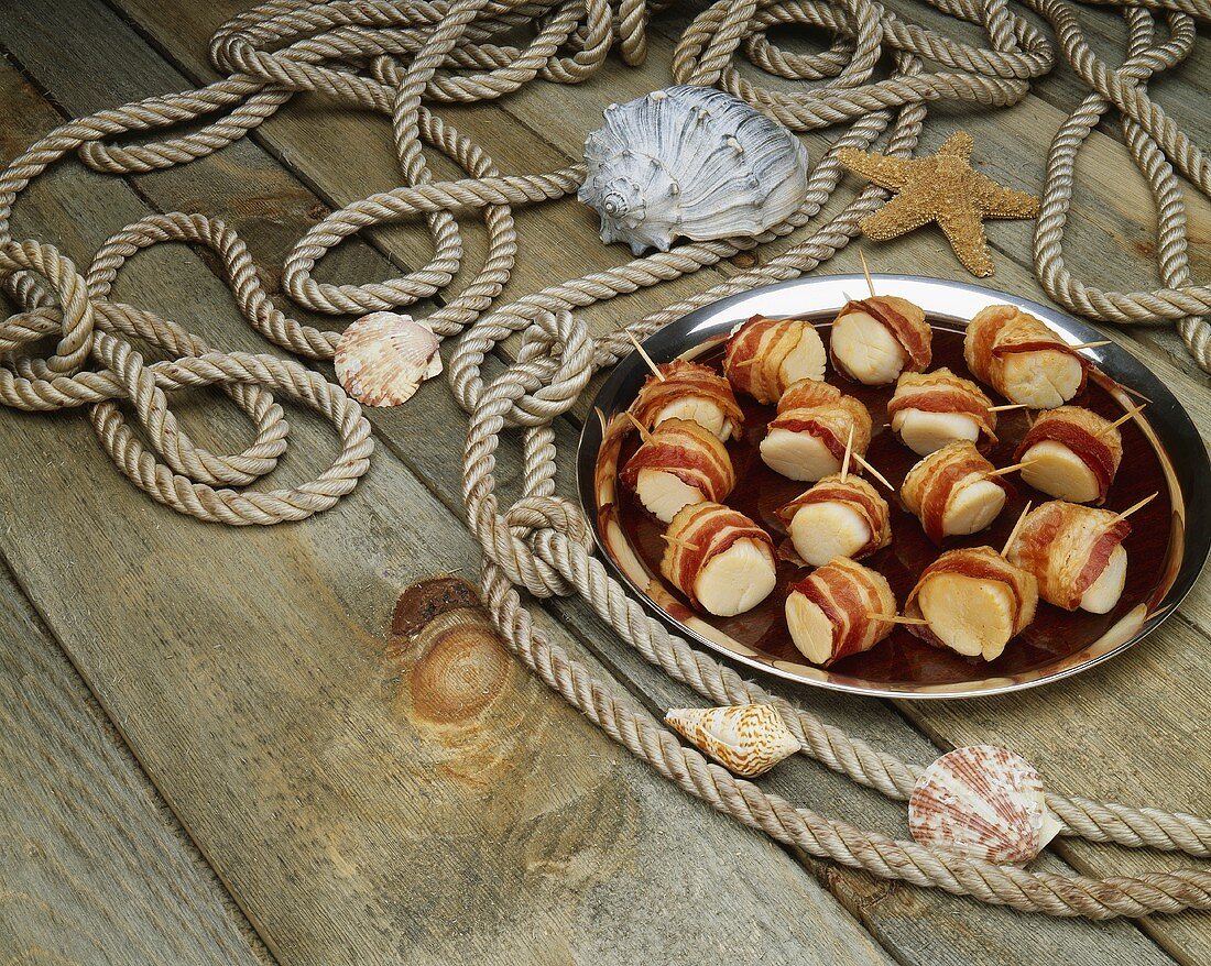Platter of Bacon Wrapped Scallops; On Dock with Rope and Shells
