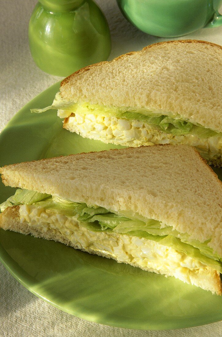 Egg Salad Sandwich with Lettuce on White Bread; Halved