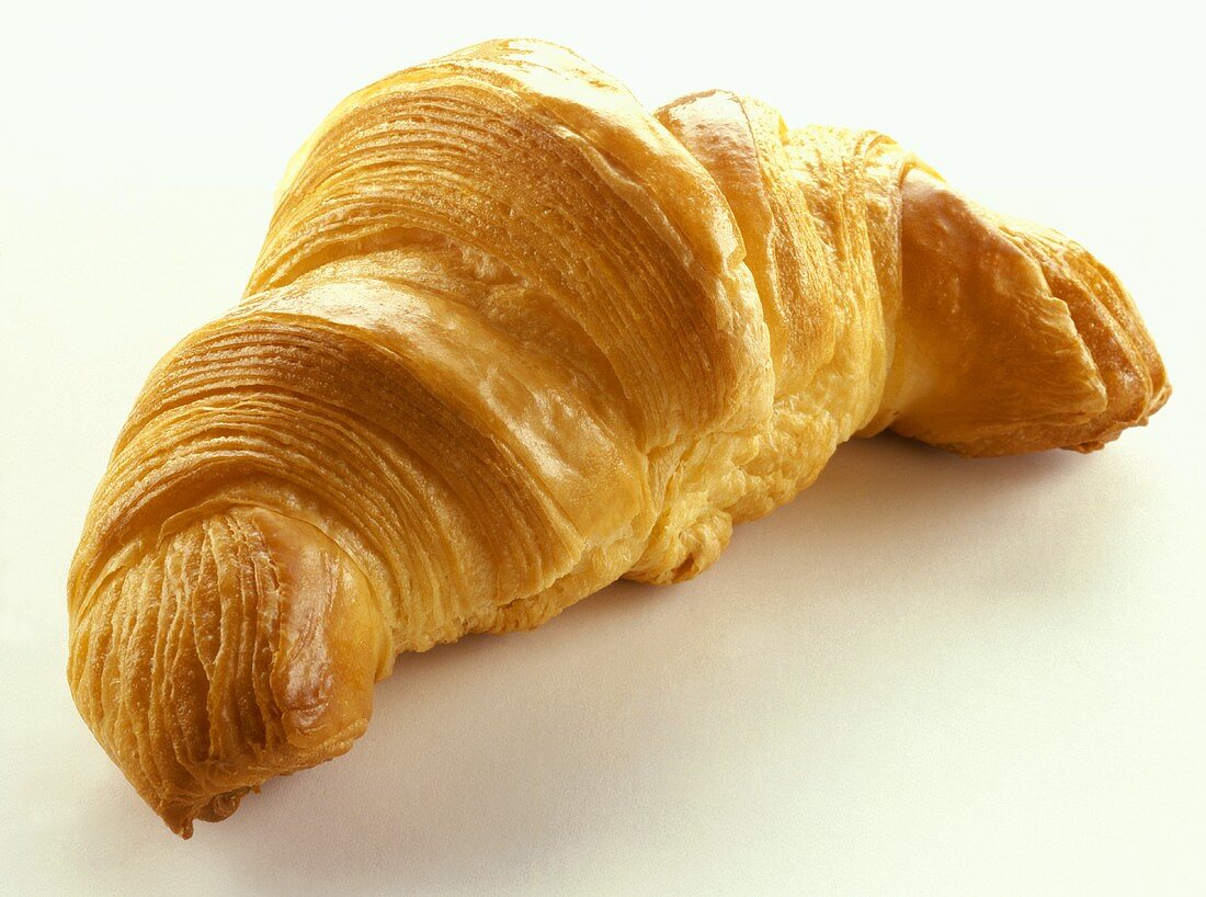 A croissant on white background