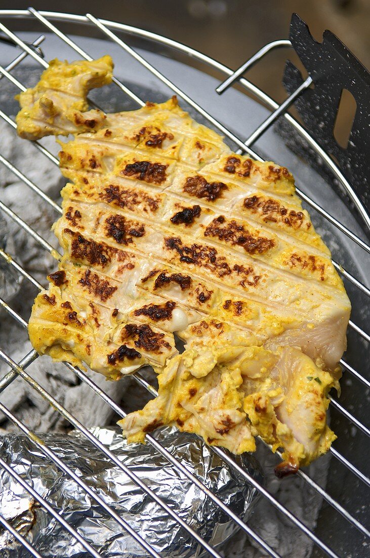 Indian chicken steak on the barbecue