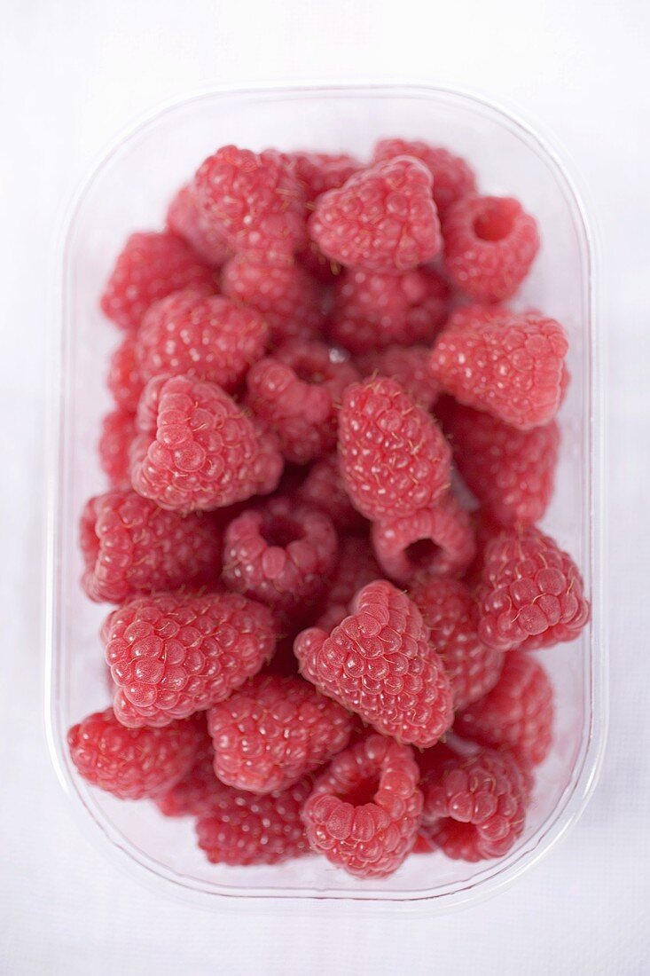 Raspberries in plastic punnet