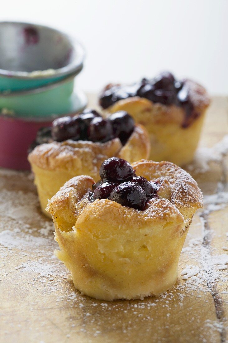 Individual bread puddings with cherries & icing sugar