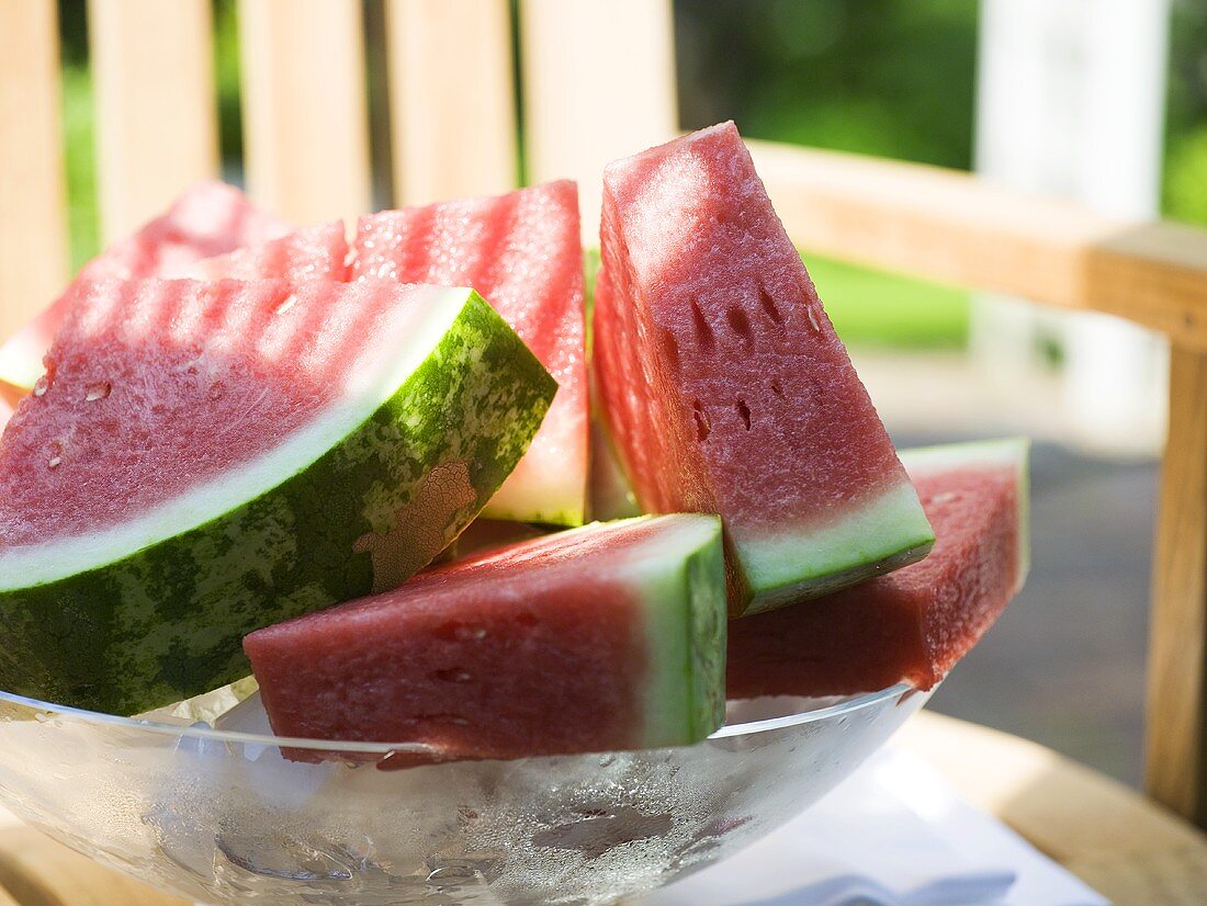 Watermelon wedges in a bowl of ice cubes