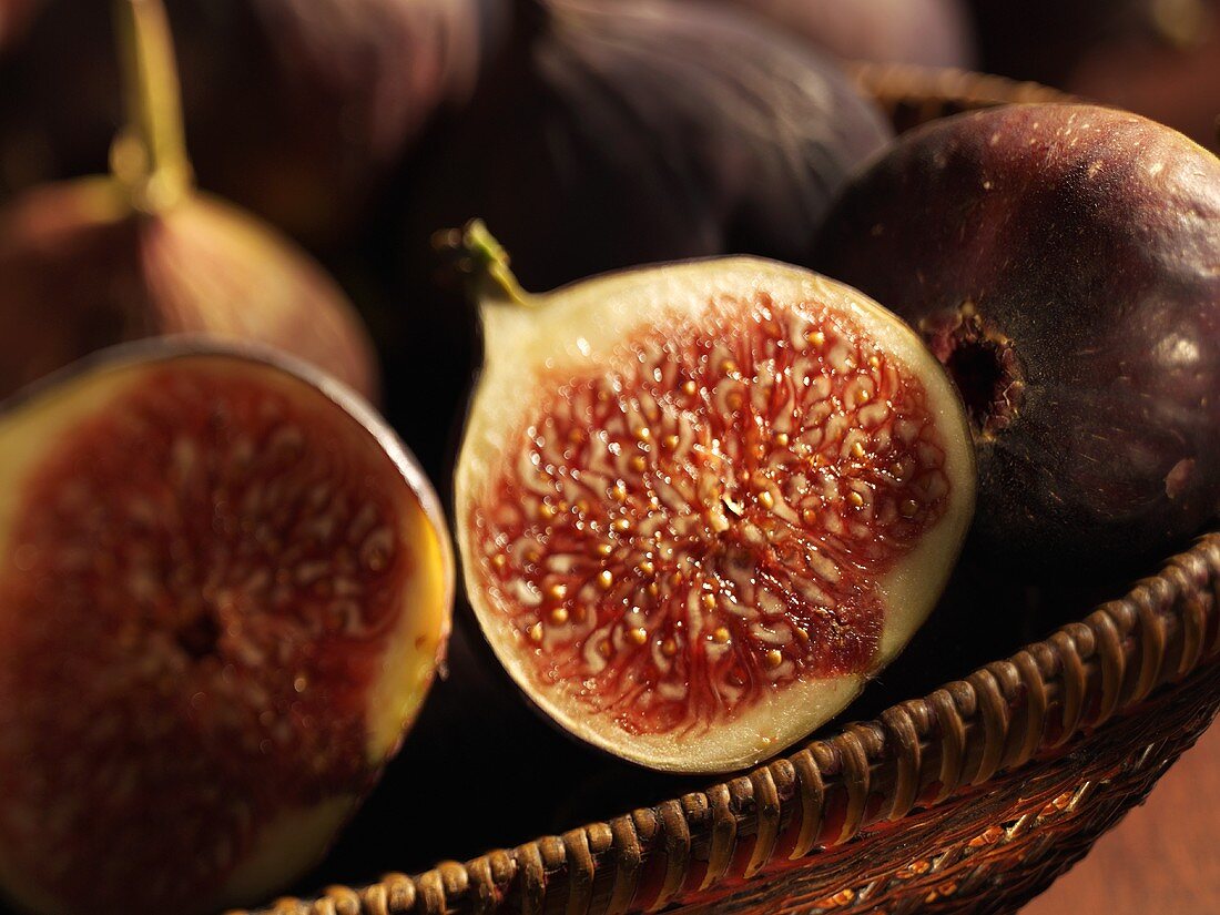 Whole and half figs in a basket