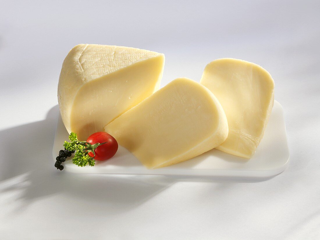 Three pieces of Kashkaval (sheep's milk cheese, Romania)