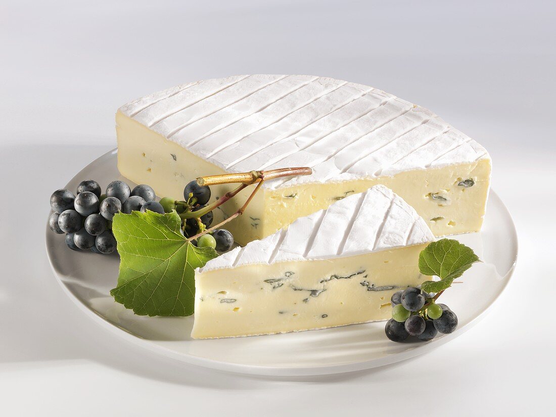 Blue cheese with black grapes