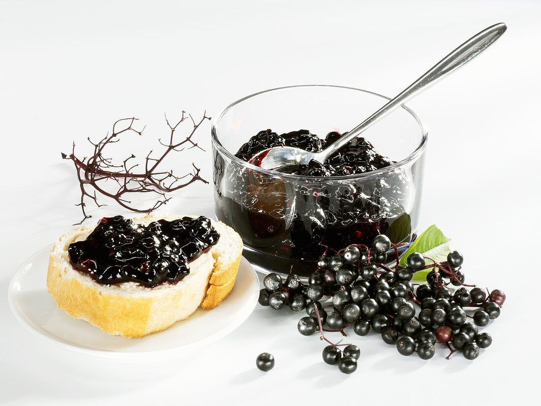 Elderberry jam on bread and in a small glass bowl