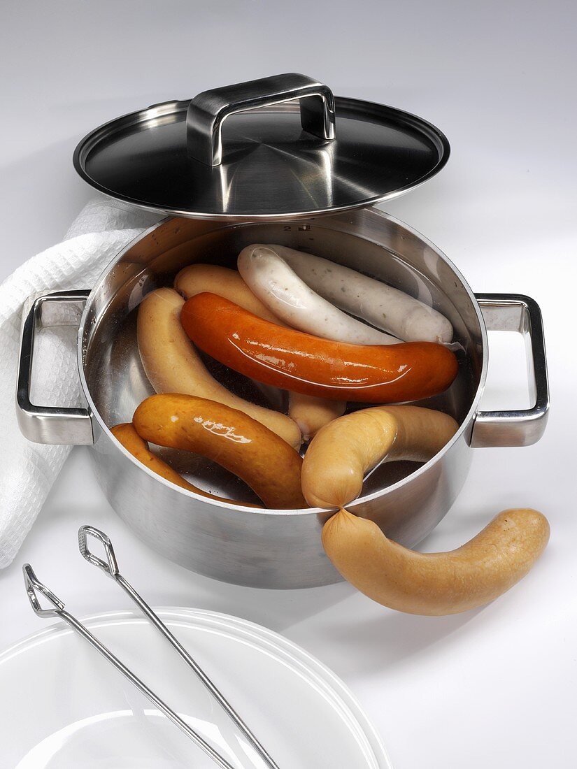 Various types of sausages in a pan