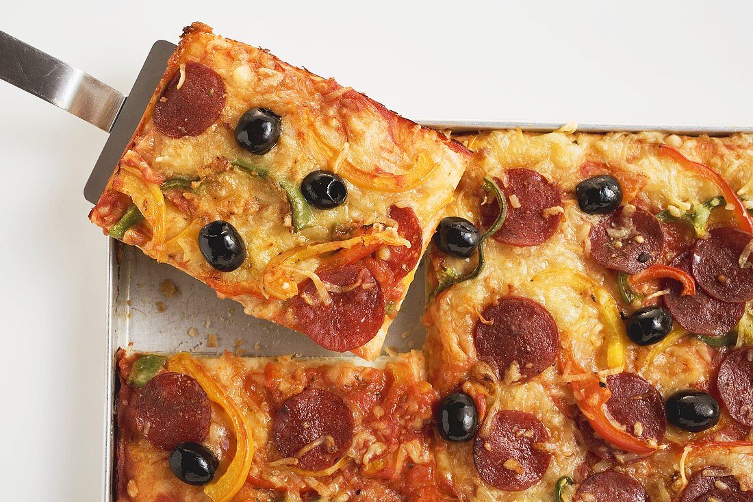 Salami pizza with peppers and olives