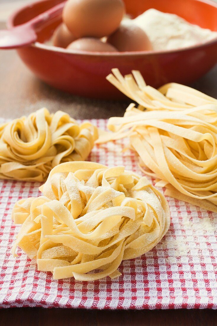 Three ribbon pasta nests