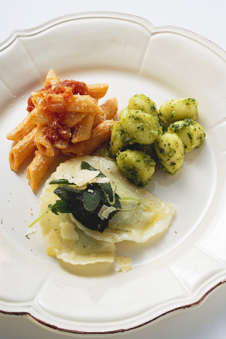 Three pasta dishes on one plate