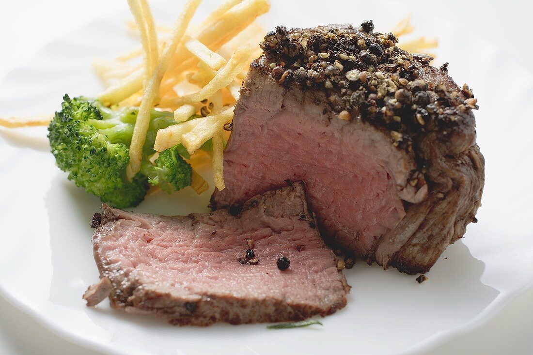 Beef fillet with pepper crust, chips and broccoli