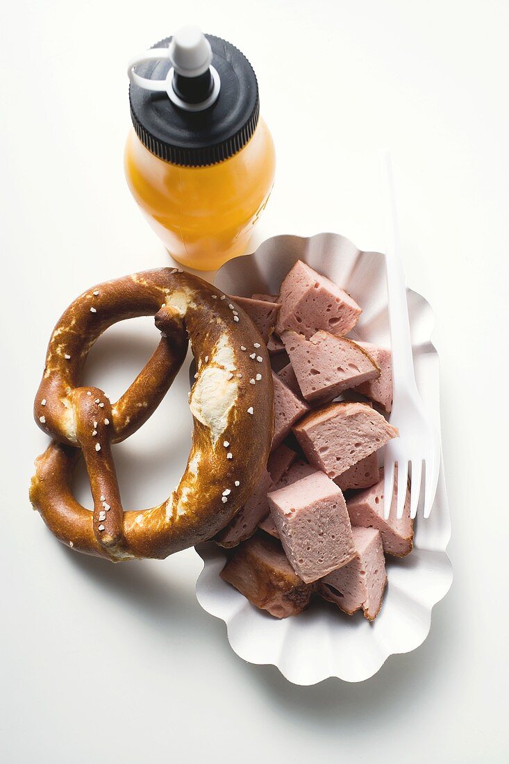 Warm Leberkäse (type of meatloaf), in pieces, with pretzel