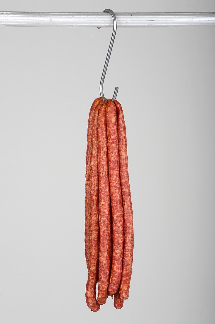 Mettwurst (cured, smoked pork sausages) on a hook