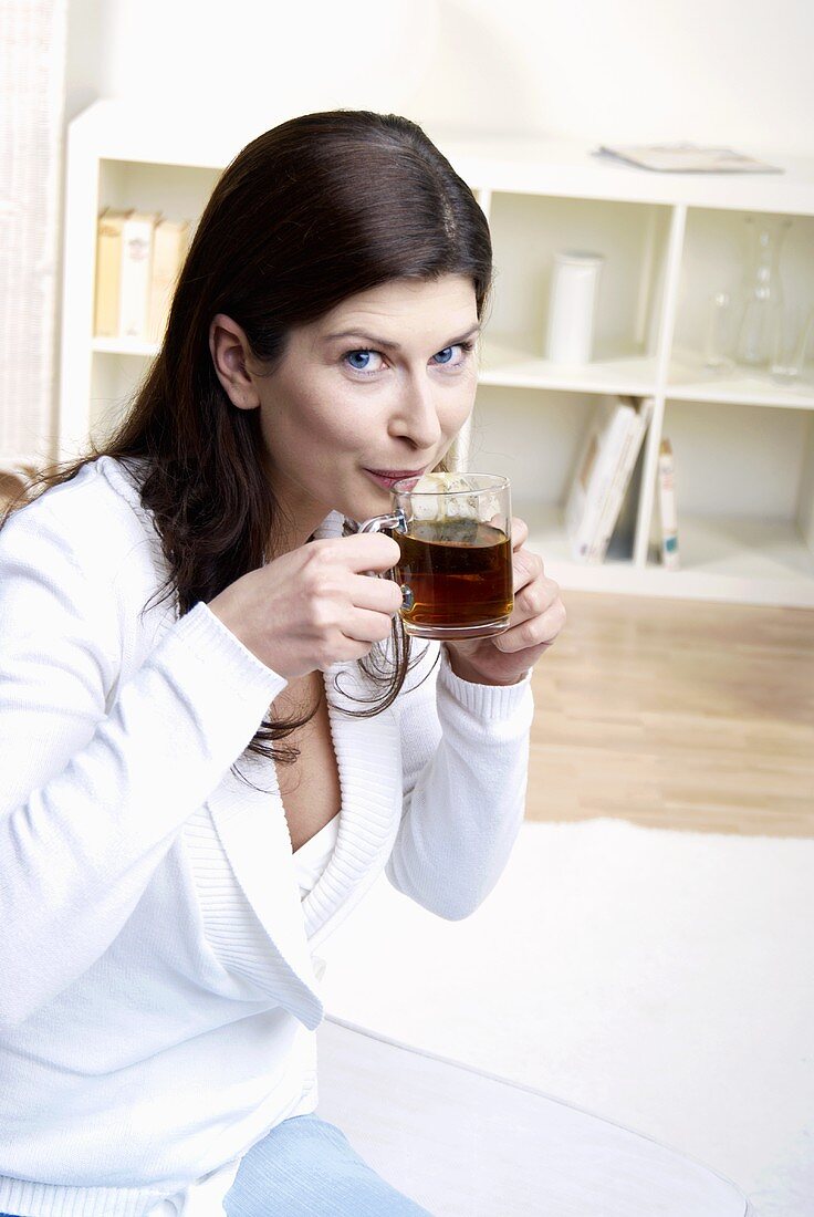 Woman drinking a cup of tea