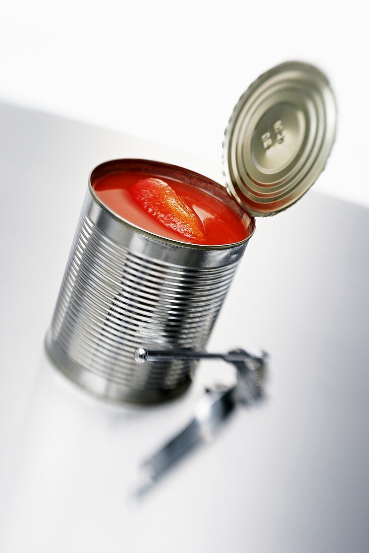 Tomatoes in tin with tin opener