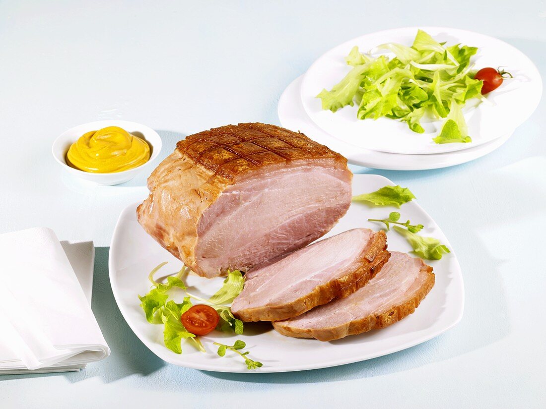 Cooked ham with mustard and salad