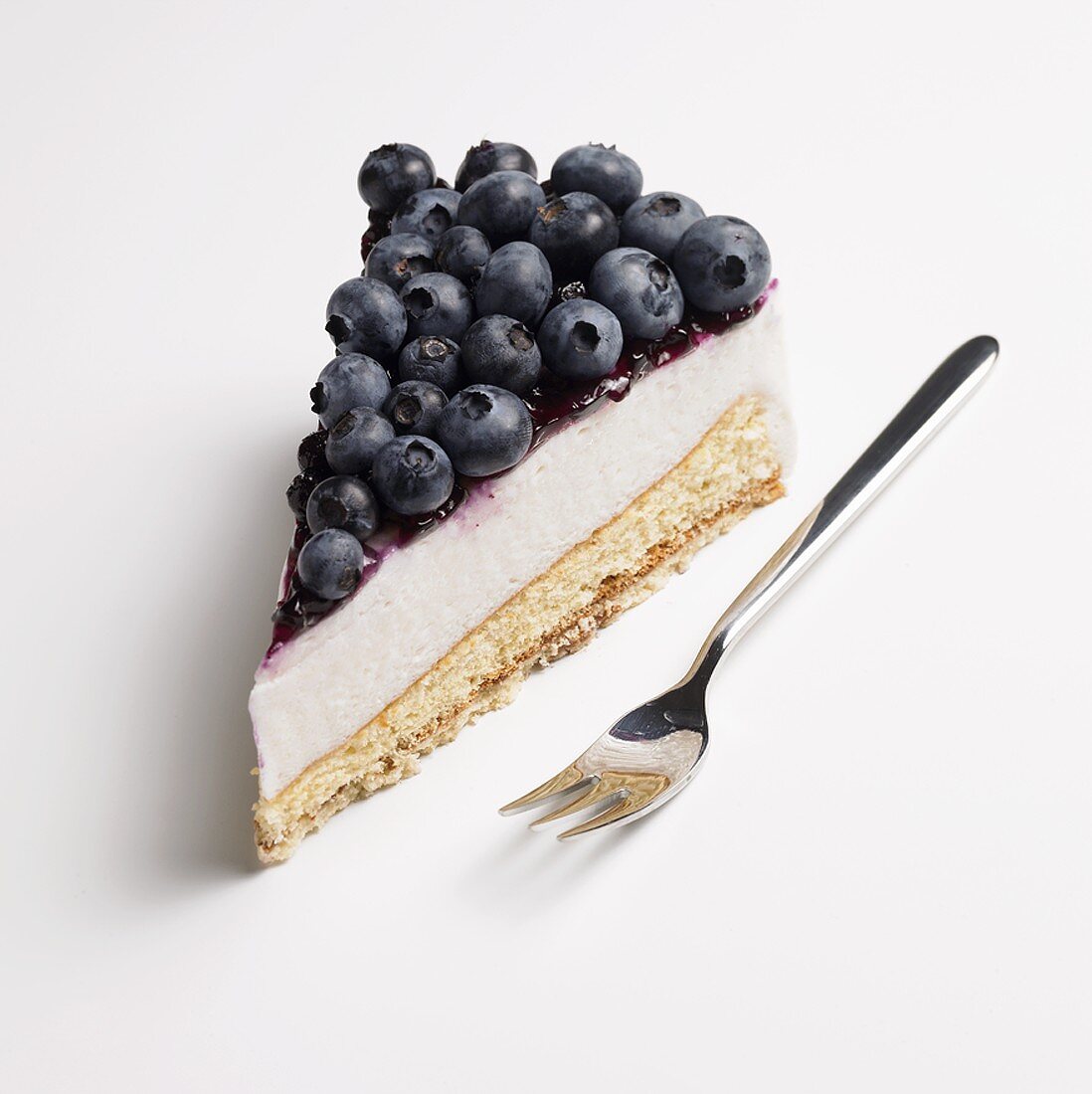 A piece of blueberry cream cake