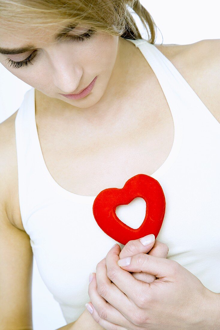 Woman holding a heart in her hands