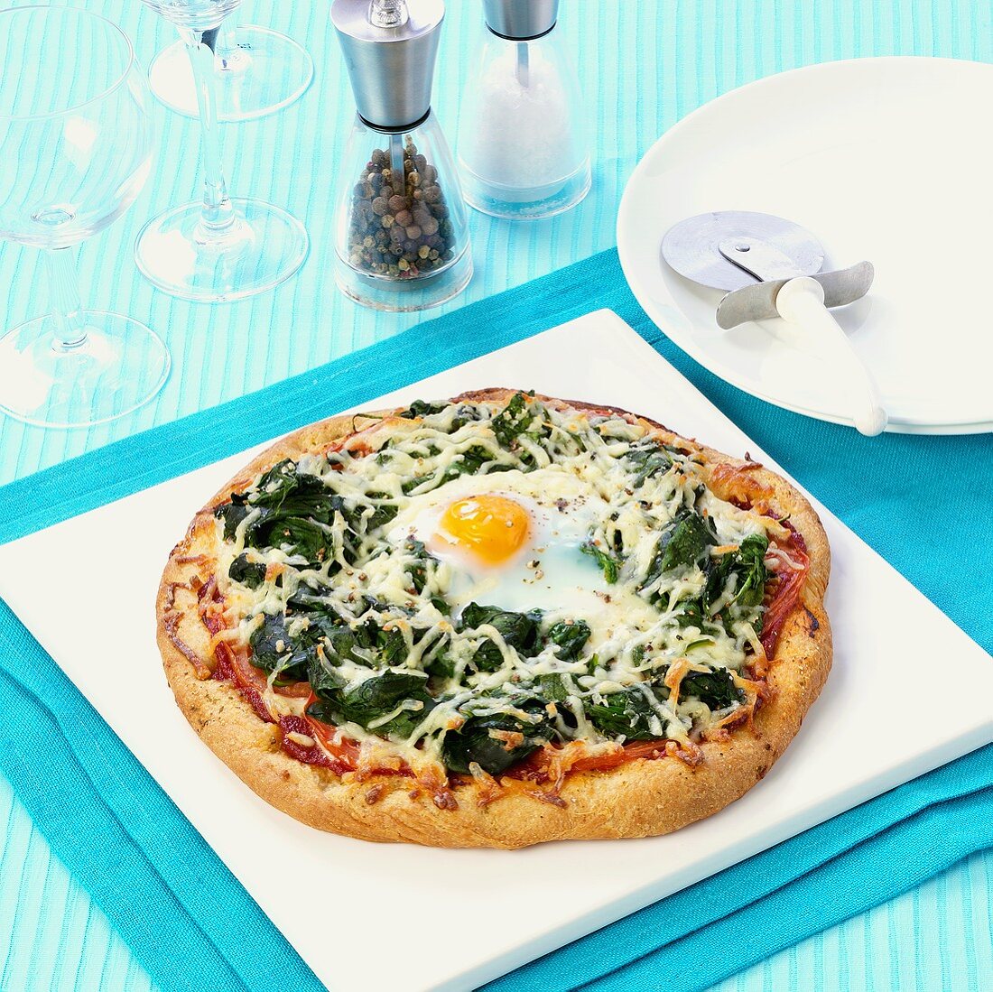 Spinach pizza with fried egg