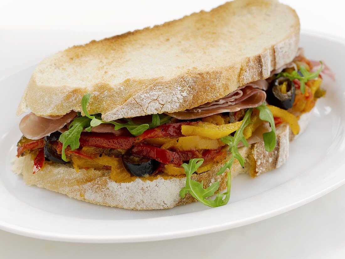 Pepper, olive and Parma ham sandwich