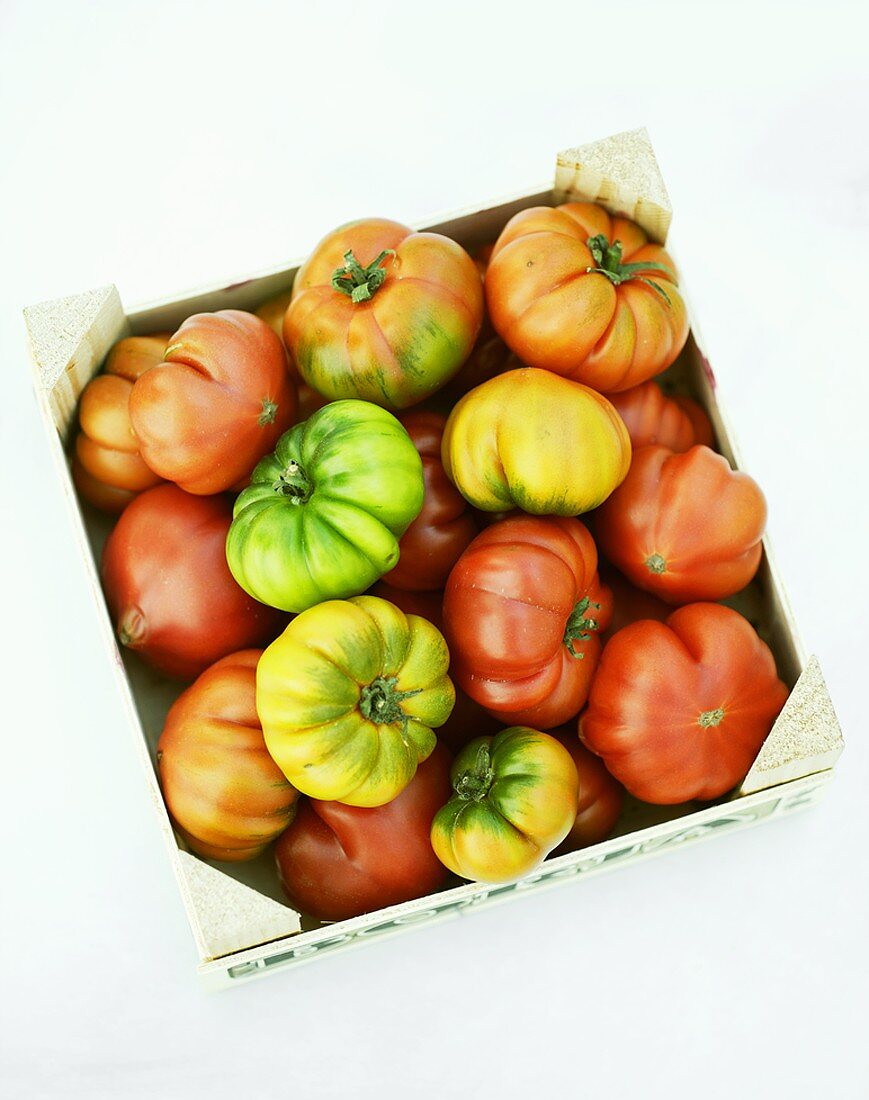 Beefsteak tomatoes in a wooden box