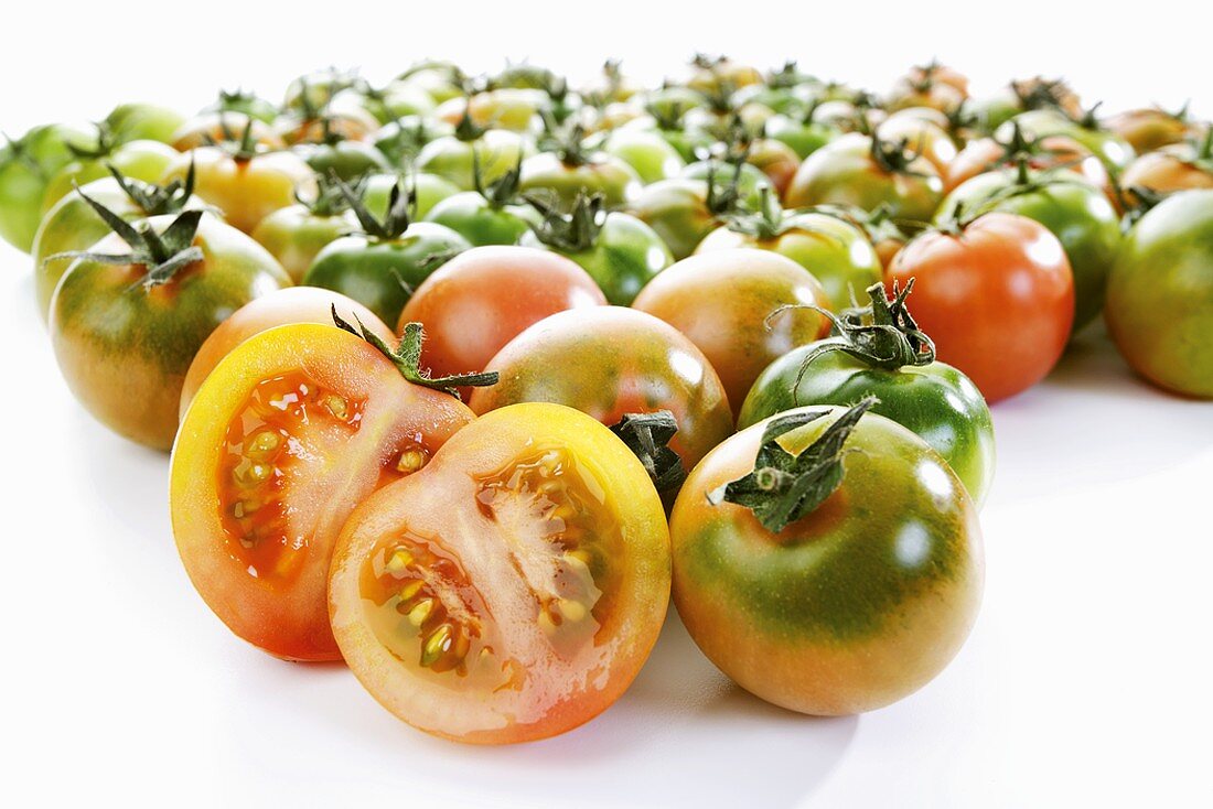Unripe tomatoes, one halved