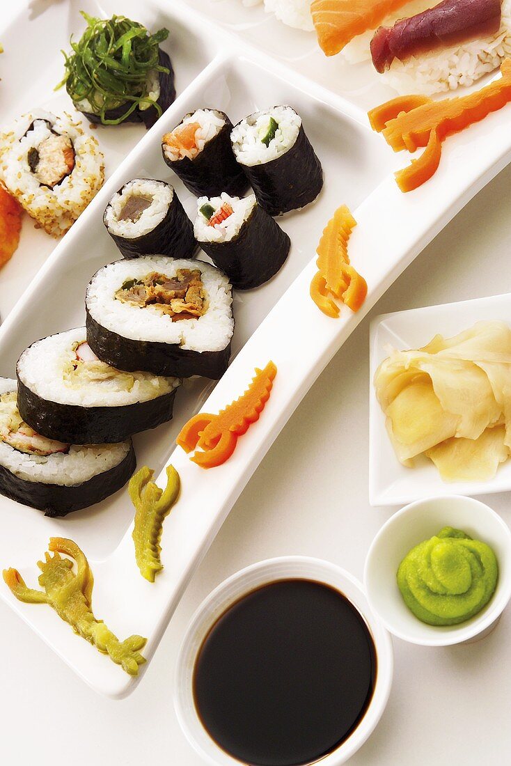 Sushi platter with soy sauce, wasabi paste & pickled ginger