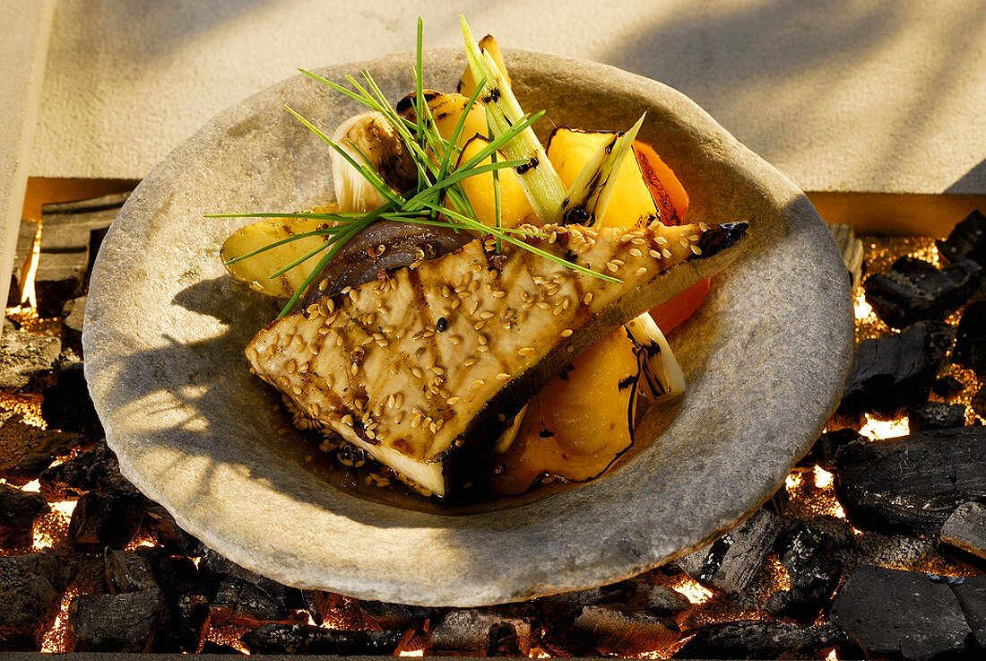 Grilled swordfish steak with vegetables