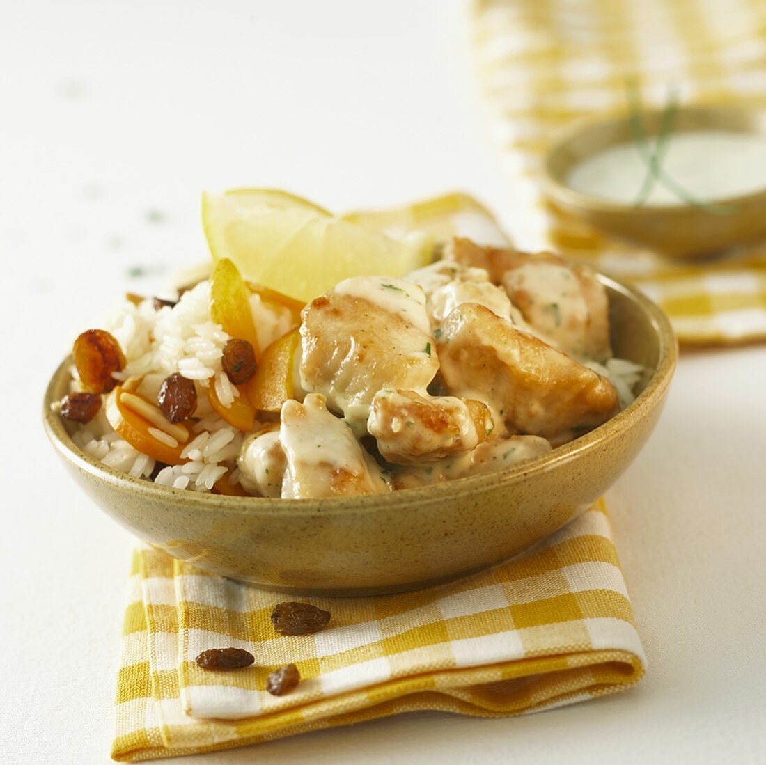 Lemon chicken with raisins on basmati rice