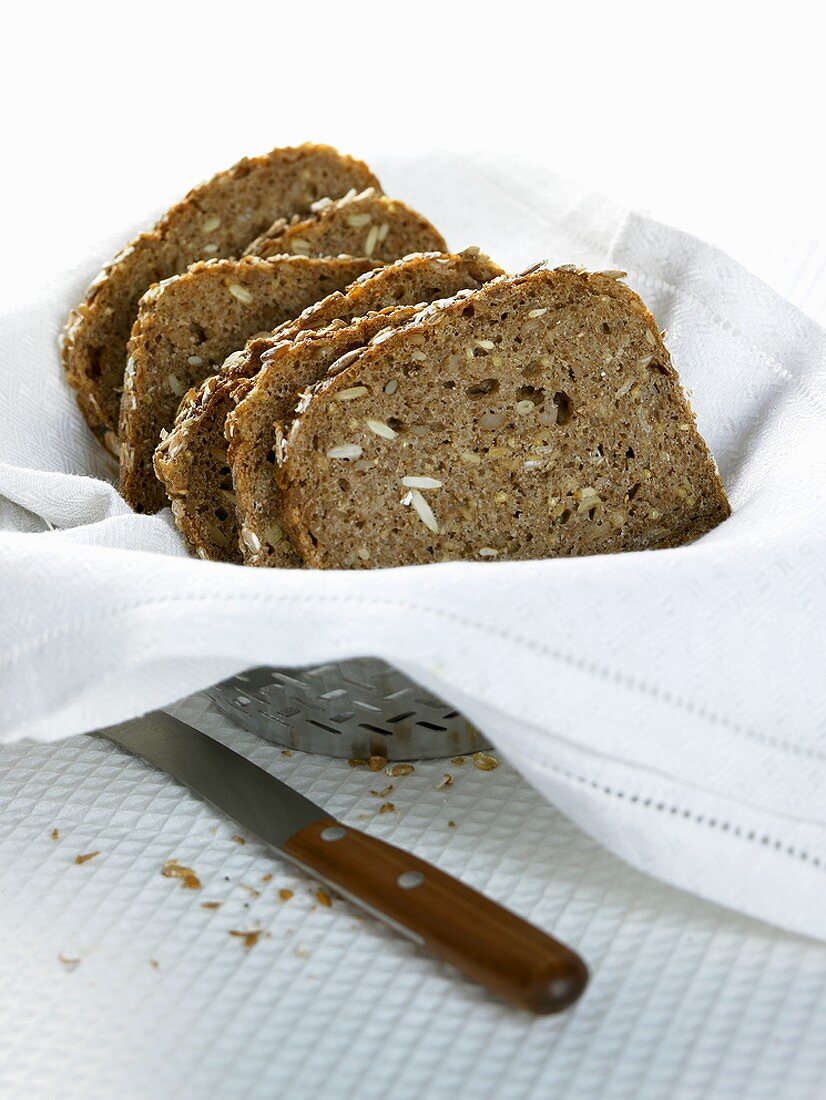 Sliced wholegrain bread in a bread basket
