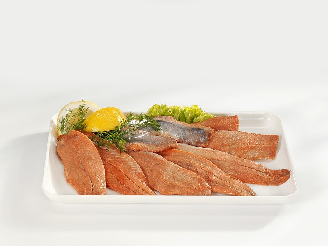 Smoked matjes herring fillets on a platter