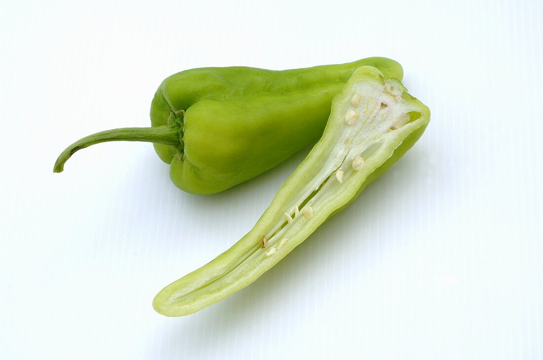 Half and whole green pointed pepper