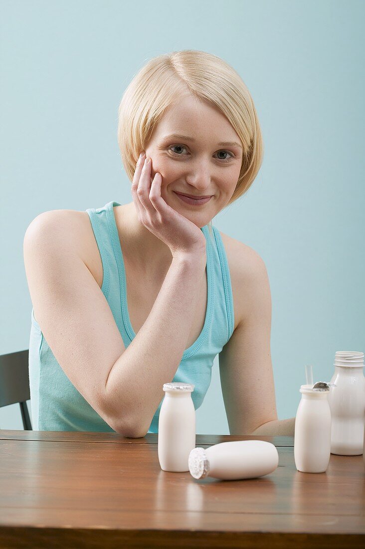 Young woman with milk drinks