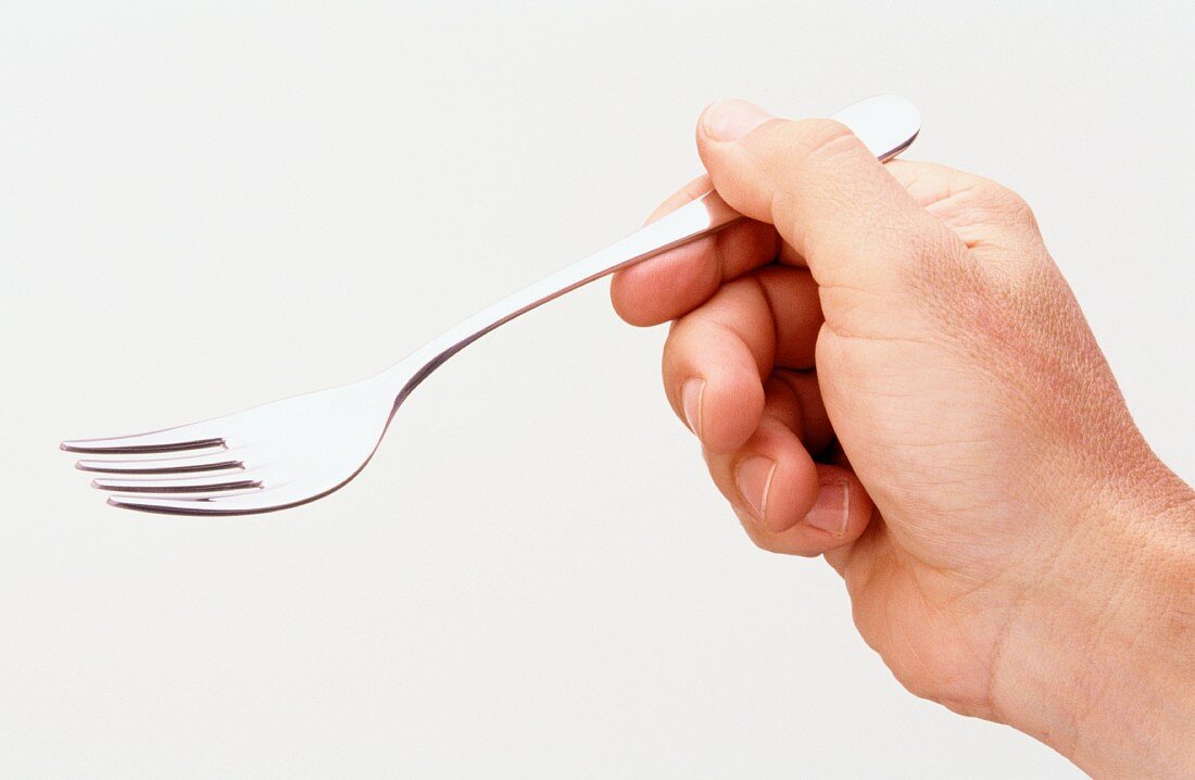 Hand holding fork