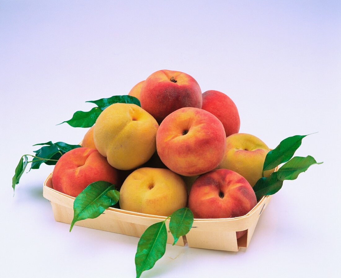 A punnet full of peaches