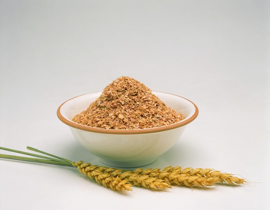 Wheat in a bowl and ears of wheat