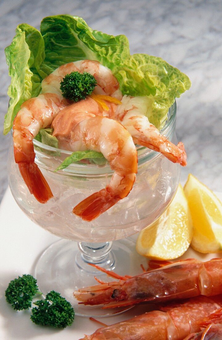 Shrimp Cocktail Served in a Stem Glass with Crab Meat and Sauce, Lemon Slice