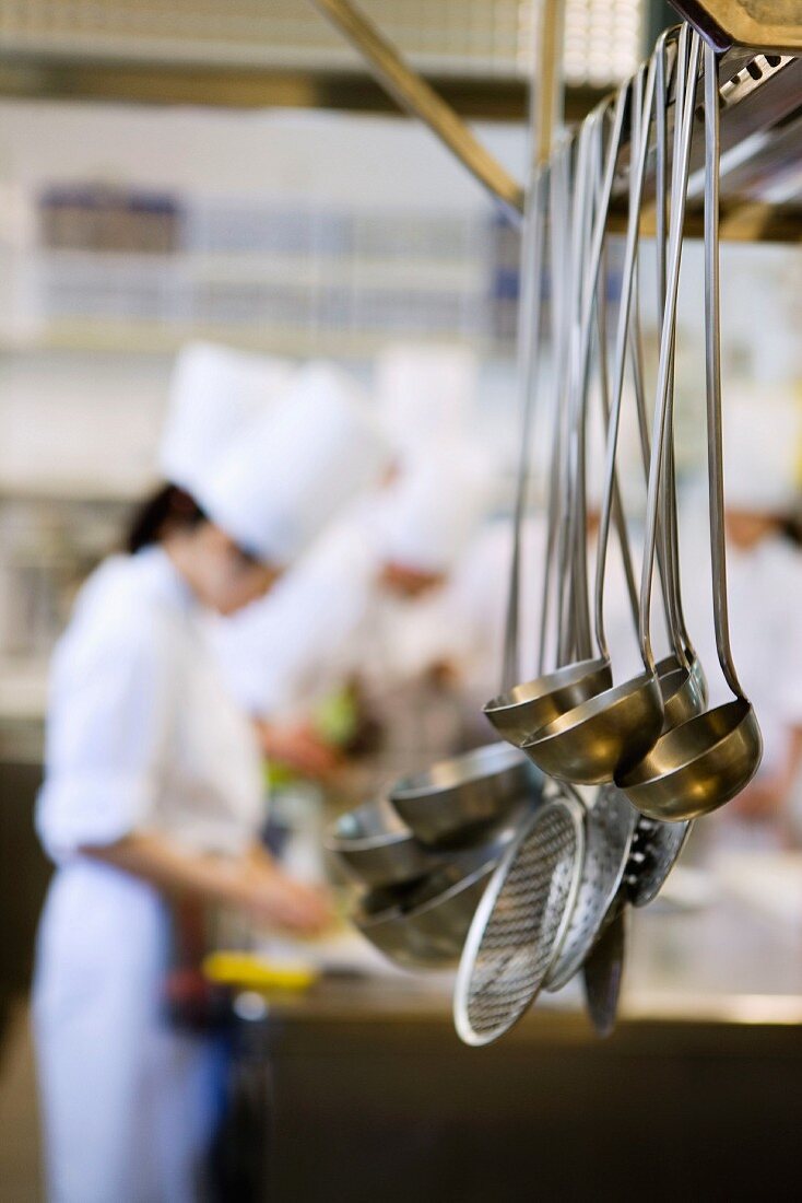 Ladles hanging in a commercial kitchen