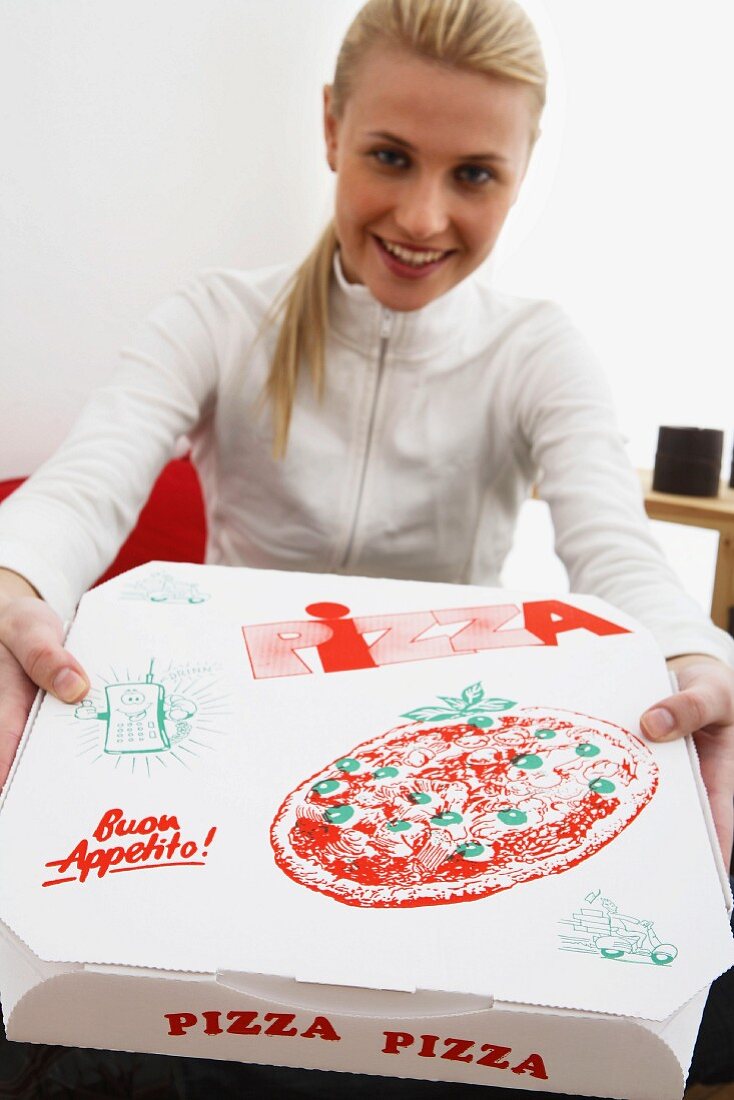 Blonde woman holding pizza box