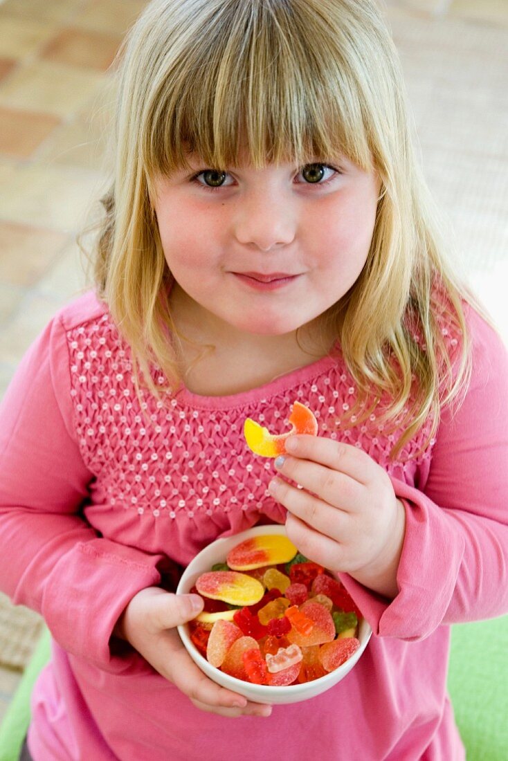 Girl eating fruit gums