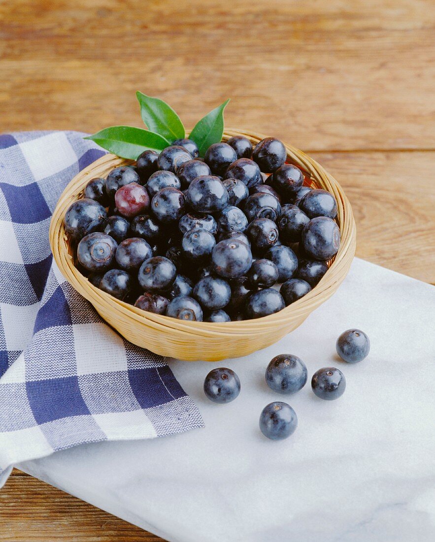 Fresh blueberries in a wicker bowl