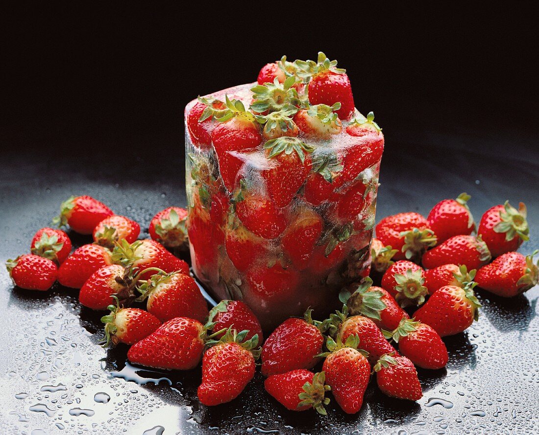 Frozen strawberries in a block of ice