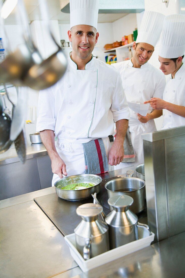 Chefs cooking asparagus