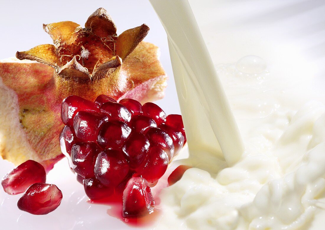 Milk and fresh pomegranate seeds